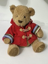 House of Fraser Russ Bear 2005 10” wearing a red duffle Hooded Coat 