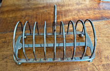 Large silver plated toast rack.  Worn but still good and useful!