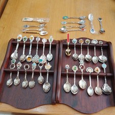 2 WOODEN SOUVENIR SPOON RACKS AND 34 SPOONS 