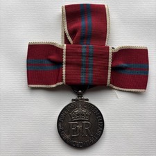 1953 Coronation medal on ladies’ ribbon bow. Original silk ribbon.