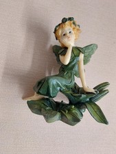 Fairy Sitting on Lily Flower