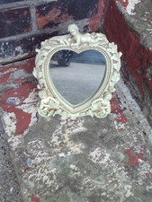 cream coloured mirror with
