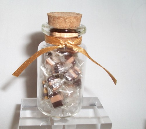 Miniature jar filled with - ,