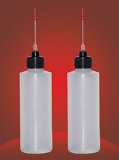 2-4 OZ bottles with stainless