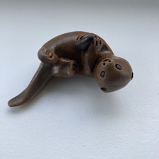 Pottery Otter With Fish 