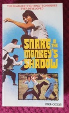 SNAKE IN THE MONKEY'S SHADOW