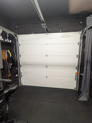 Sectional garage door with - door,