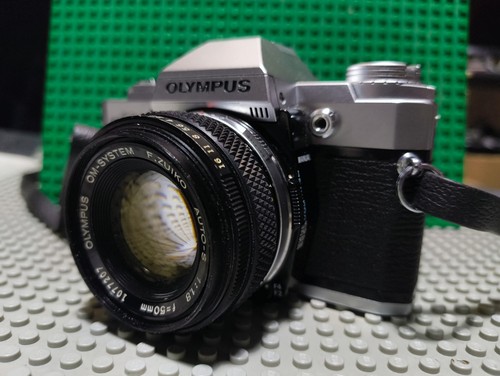 Olympus with 50mm - with,