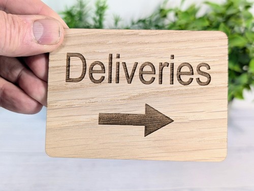 Wooden deliveries sign with - "deliveries",