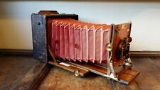 1900'S ANTIQUE 1/2 PLATE RED BELLOWS CAMERA - THE SANDERSON - MAHOGANY & BRASS
