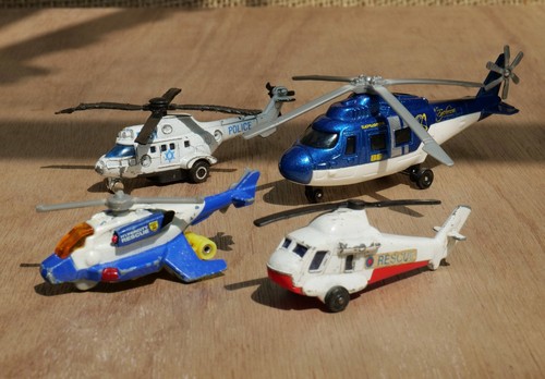 Seven diecast helicopters