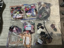 Large bundle of doll clothing