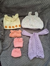 A Bundle Of Hand Knitted Dolls