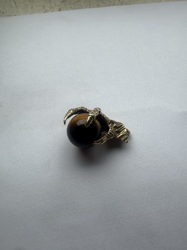 Gold eagles claw holding