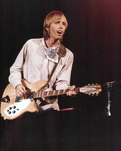 Tom petty playing his guitar - petty,
