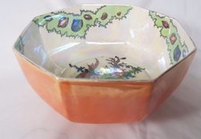 CROWN DUCAL LARGE LUSTRE OCTAGONAL BOWL WITH ASIAN  FISH AND SHELL. CIRCA 1920'S