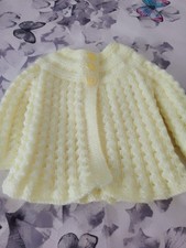 hand knitted matinee coat in lemon