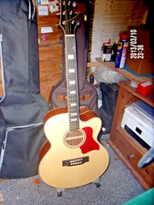 jumbo acoustic guitar used