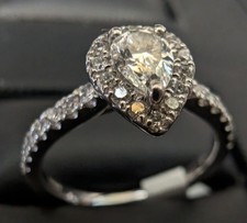 Platinum 950 Ring Large Central Pear-Shape Diamond, surrounded by small Diamonds