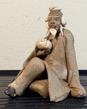 Miniature Ceramic Figurine Sitting Mud Man  