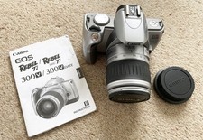 Canon EOS 300V SLR film camera with EF28-90mm lens and instructions