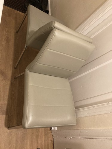 Two grey dining - , chairs