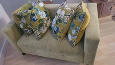 Two Seat Sofa With Four Feather Pillows. Great Conditions