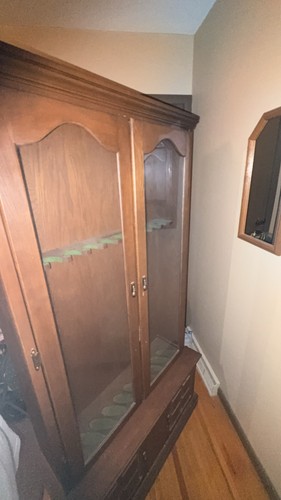 Brown wood gun cabinet - , in