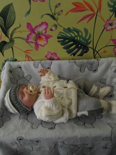 Hand knitted baby reborn doll