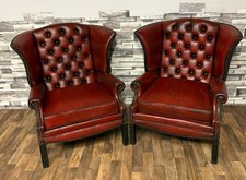 Two ox blood Red  leather chesterfield Queen Anne high back chairs 
