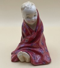 A ROYAL DOULTON FIGURINE -