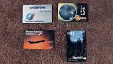 4 used telephone cards, incl