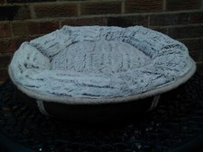 Brown doughtnut bed for cat or