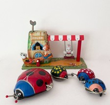 Vintage tinplate clockwork toys Ladybird Parade and Animal Playland