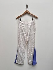 1970s style white flared trousers peacock feather Size Small Ex Hire Fancy Dress