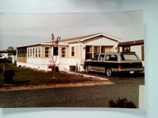 1983 mobile home with parked - home,