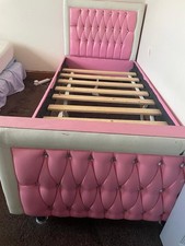 Pink Single Bed Frame With Wooden Underlay And Space For Storage Underneath