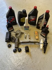 BOX OF ASSORTED BOAT SPARES LUBRICANTS TOOLS ANODE OILS PROP SPANNER ETC