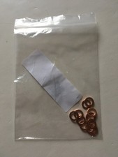 Twelve Copper Washers No. 6