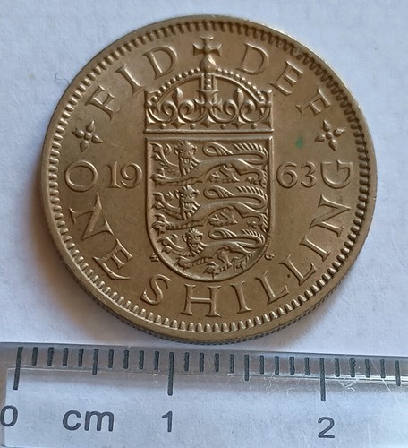 1963 shilling coin - (english),