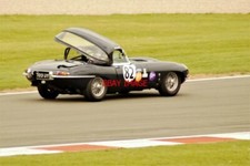 PHOTO  CRANER CURVES BOB BINFIELD'S JAGUAR E-TYPE TRIES TO SHED ITS HARD TOP. HE