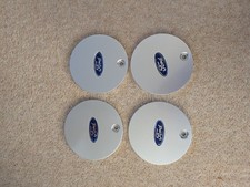 Genuine FORD alloy wheel centre caps.  New. H95 SX 1000AA  Capri, Escort, Focus 