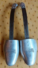A pair of vintage J Sears & Co True Form Boot Co Ltd metal shoe stretchers