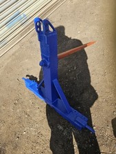 TRACTOR MOUNTED BALE SPIKE. 