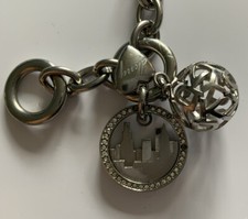 DKNY STAINLESS STEEL T-BAR BRACELET WITH 3 DKNY CHARMS