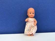 Vintage small simba doll in a