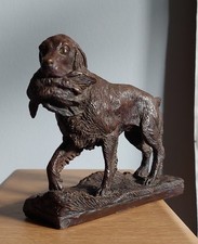 Heredities bronzed figure 'a spaniel with a bird in its mouth' by Geoffrey Tiney
