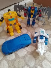 Transformers Dinobot and Bumblebee plus two generic unbranded transforming toys