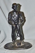 Figure Of A Metal Worker, Cast