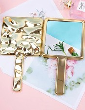 Hand held mirror - hand,